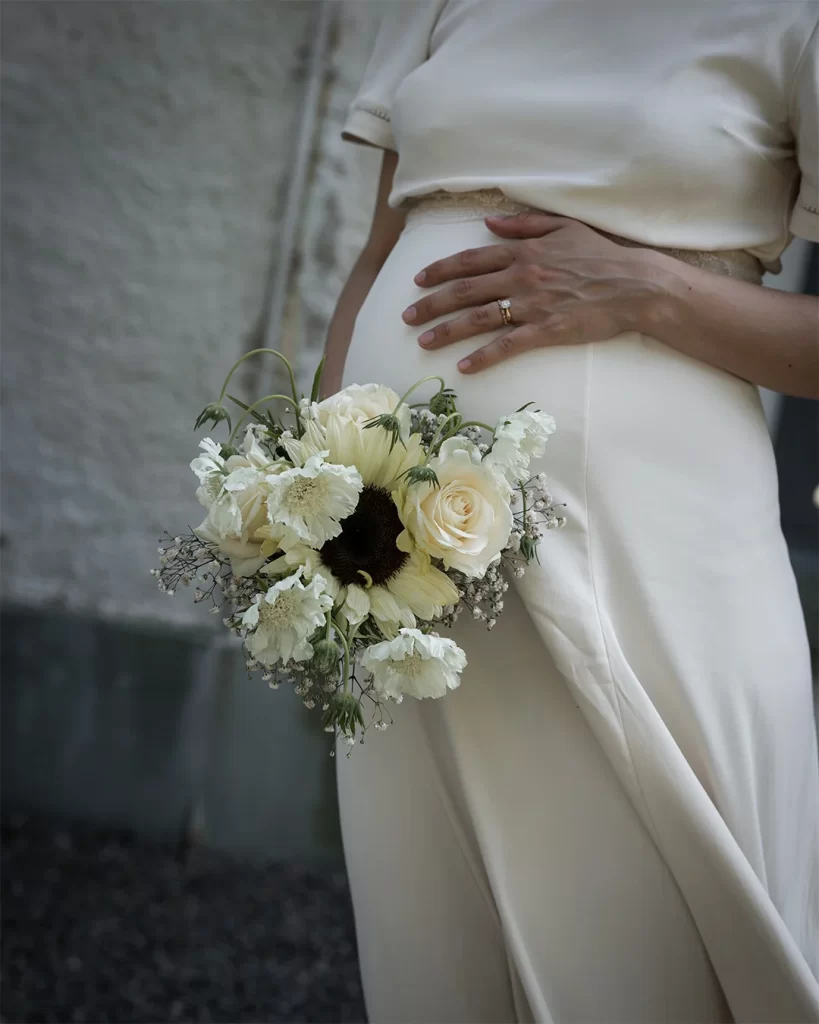 Pregnant Bride holding a bouquet